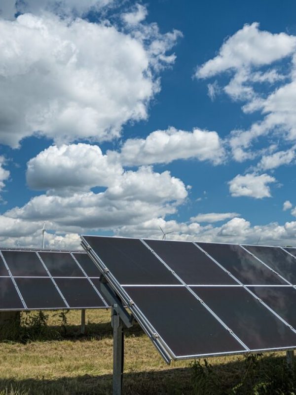 solar-panels-used-renewable-energy-field-sky-full-clouds_181624-36781